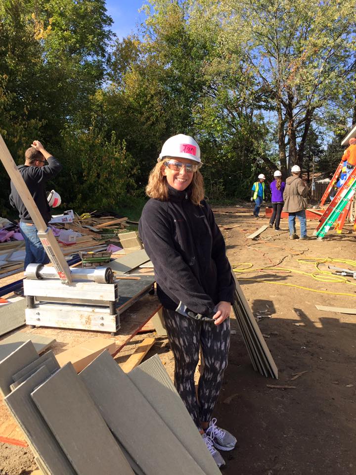 Jen Bernhardt mans the cutting station at DirectEmployers 2016 Habitat for Humanity volunteer day.