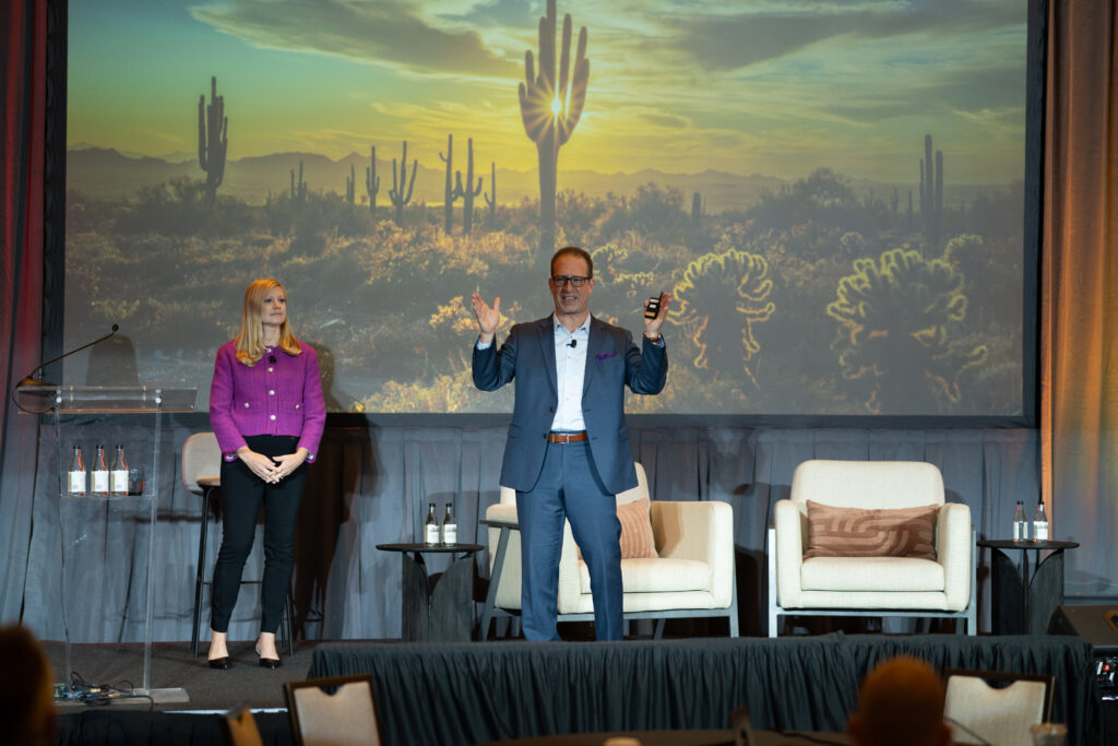 Silberman Law's Mickey Silberman and Lead Statistician Krystal Welland speak at on stage at DEAMcon25.