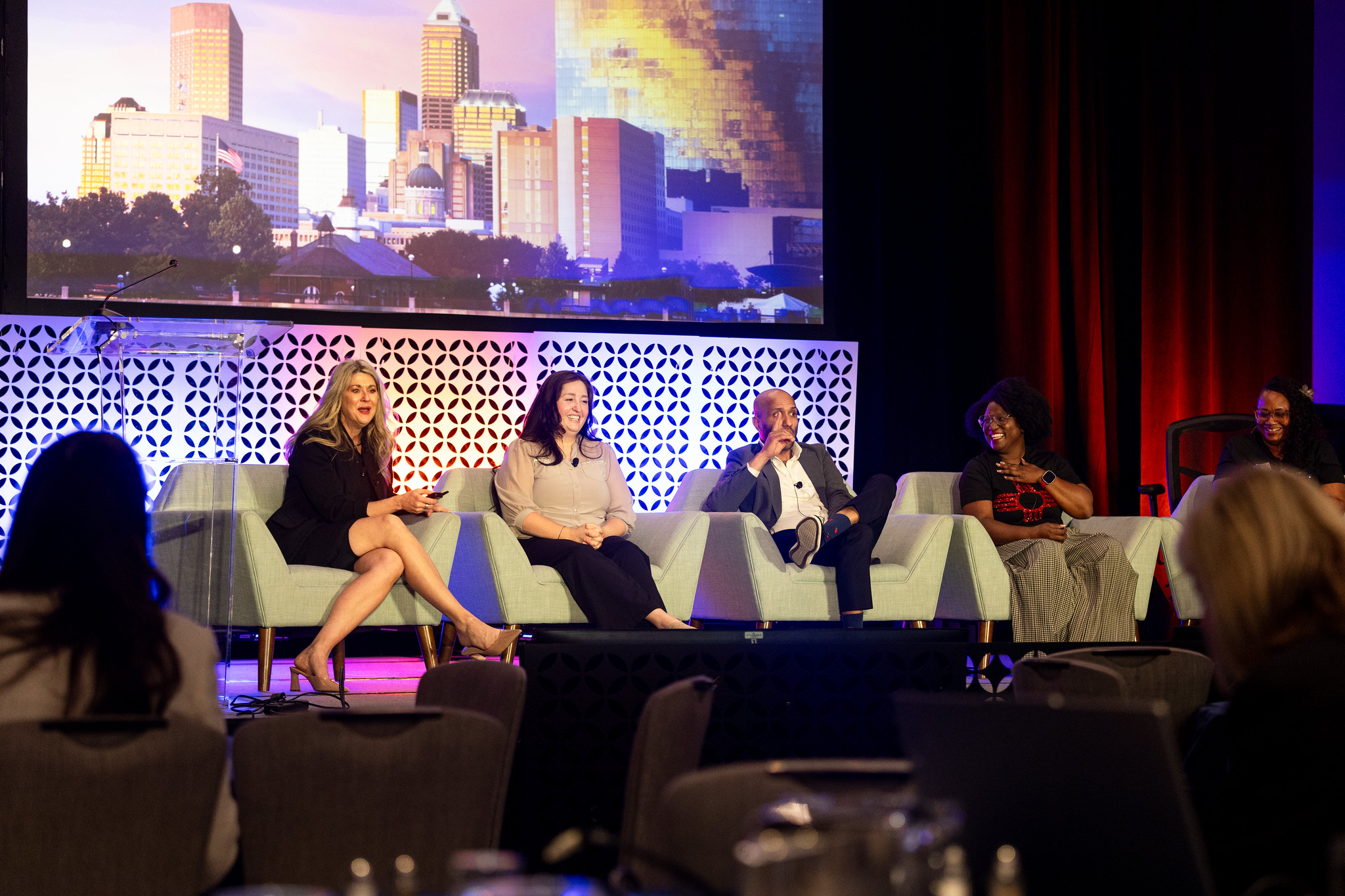 Panelists laugh during their session at DEAMcon26.