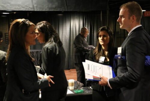Recruiters speak with attendees at the 2014 DirectEmployers Veterans Connect Career Fair.
